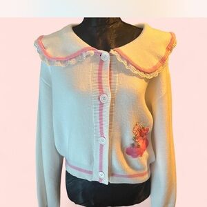 Dolls Kill Cream and Pink Sweater